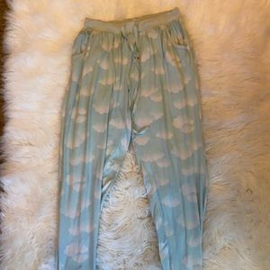 Pajama pants. Light blue with clouds. Tight at the ankles and have a drawstring.